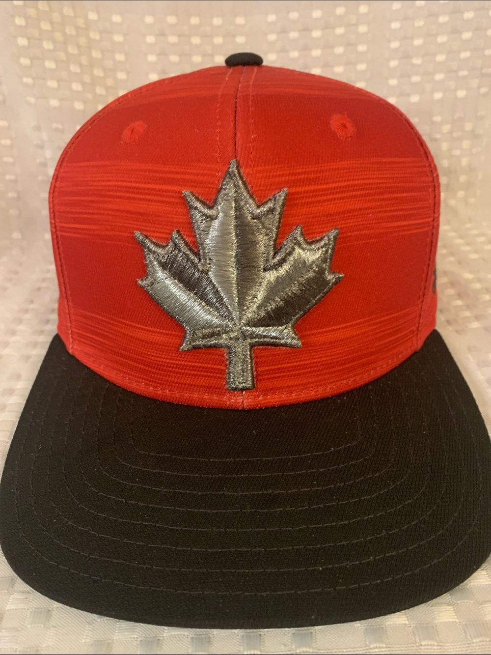 Adidas Toronto FC red cap with Toronto FC logo and silver maple leaf on cap.